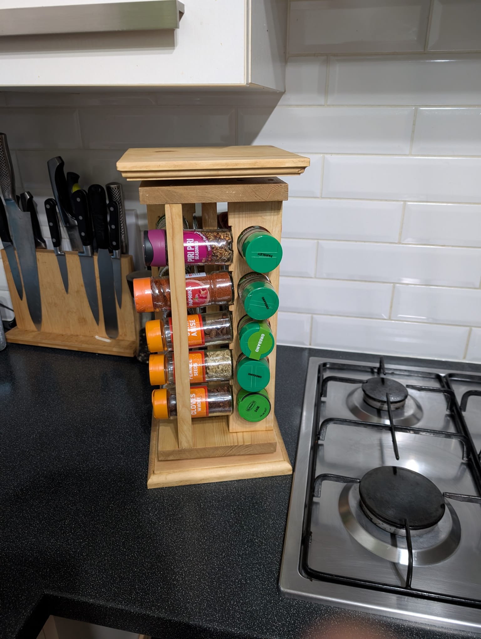 The same carousel turned to a different position, with another set of spice jars now facing the front.